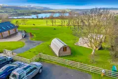 Aerial of the camping pods overlooking Llangorse Lake Aerial of the camping pods overlooking Llangorse Lake