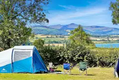 Non electric grass pitches beside Llangorse Lake