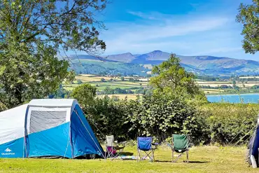 Non electric grass pitches beside Llangorse Lake