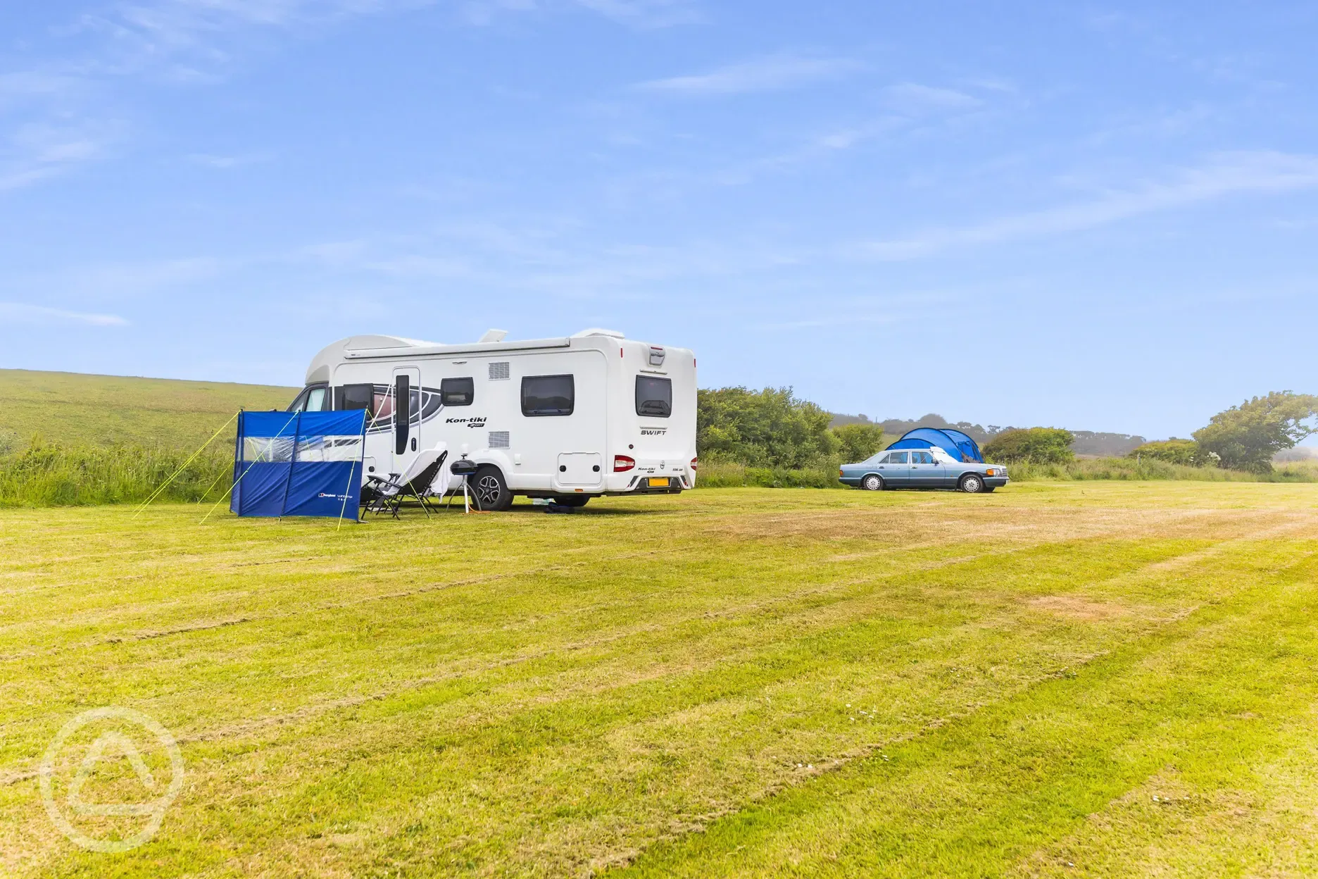 Motorhome and tent on non electric grass pitches