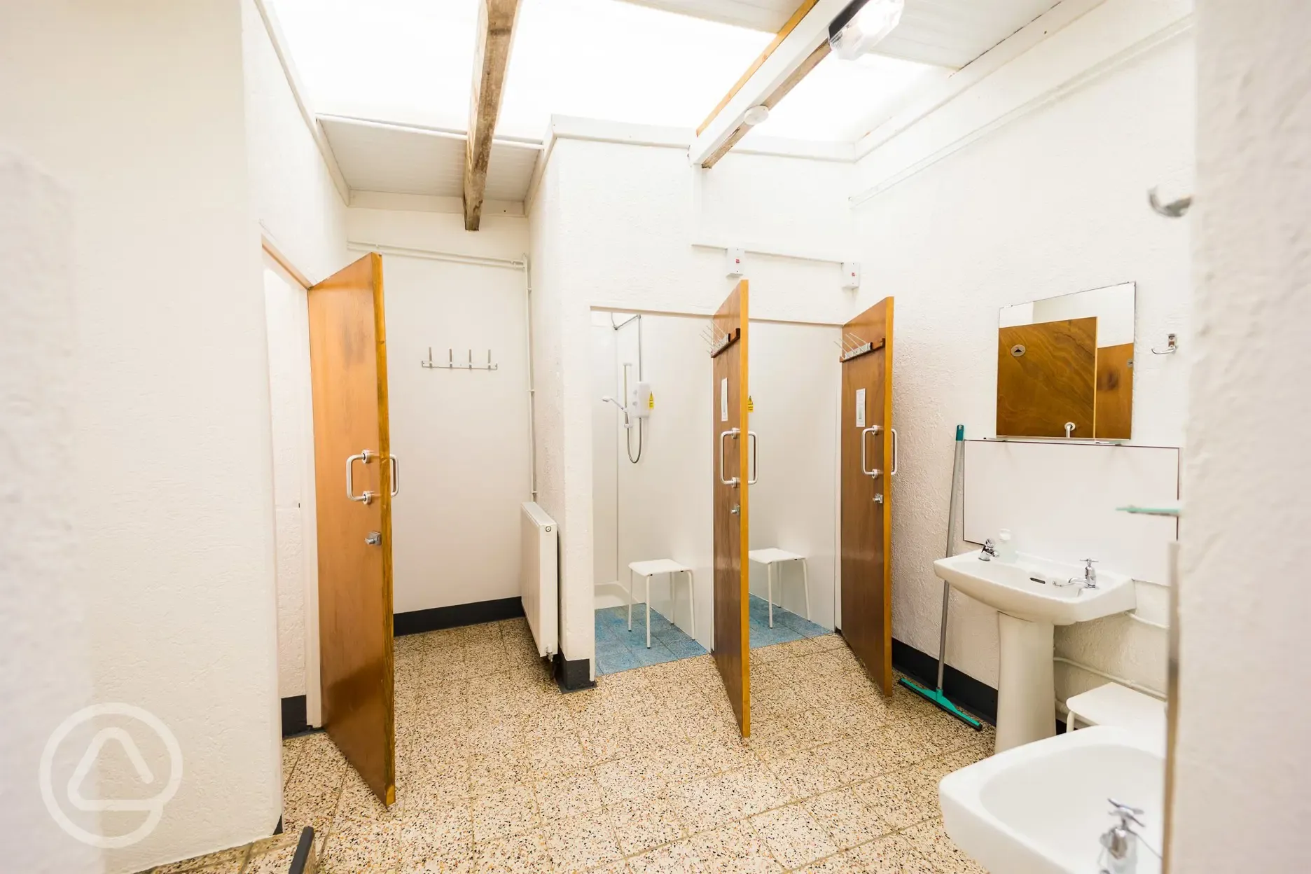 Showers with unlimited hot water, stools and hooks