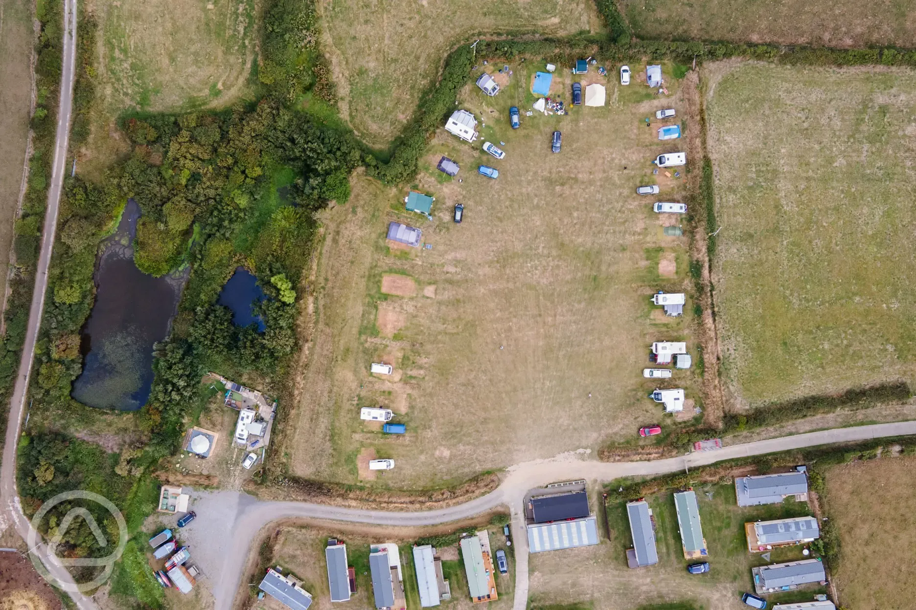 Bird's eye view of the grass pitches at Llanungar Caravan and Camping