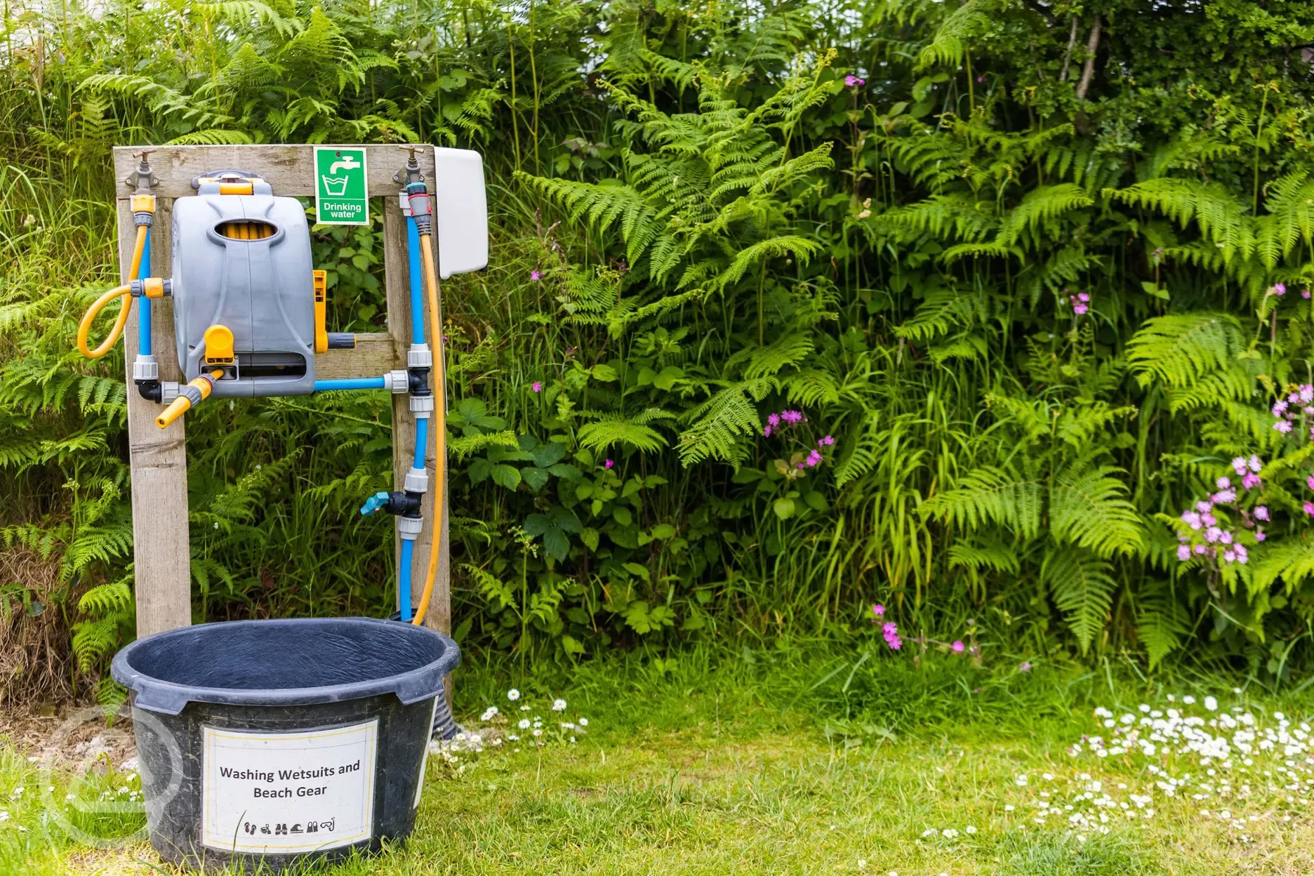 Outdoor wash point for wetsuits, beach gear, and muddy boots