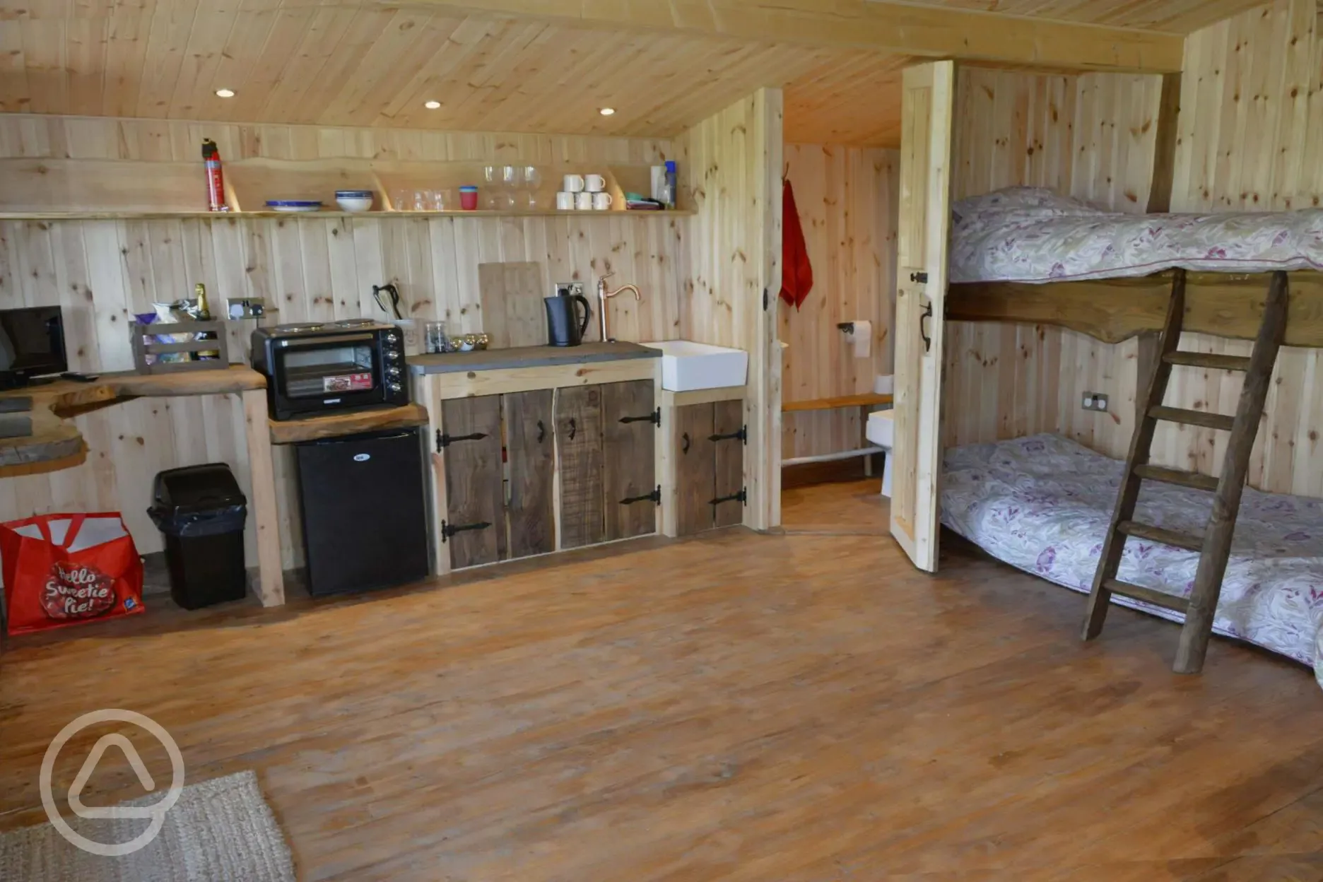 Caradoc Lodge with a kitchen including gas hob and fridge Caradoc Lodge with a kitchen including gas hob and fridge