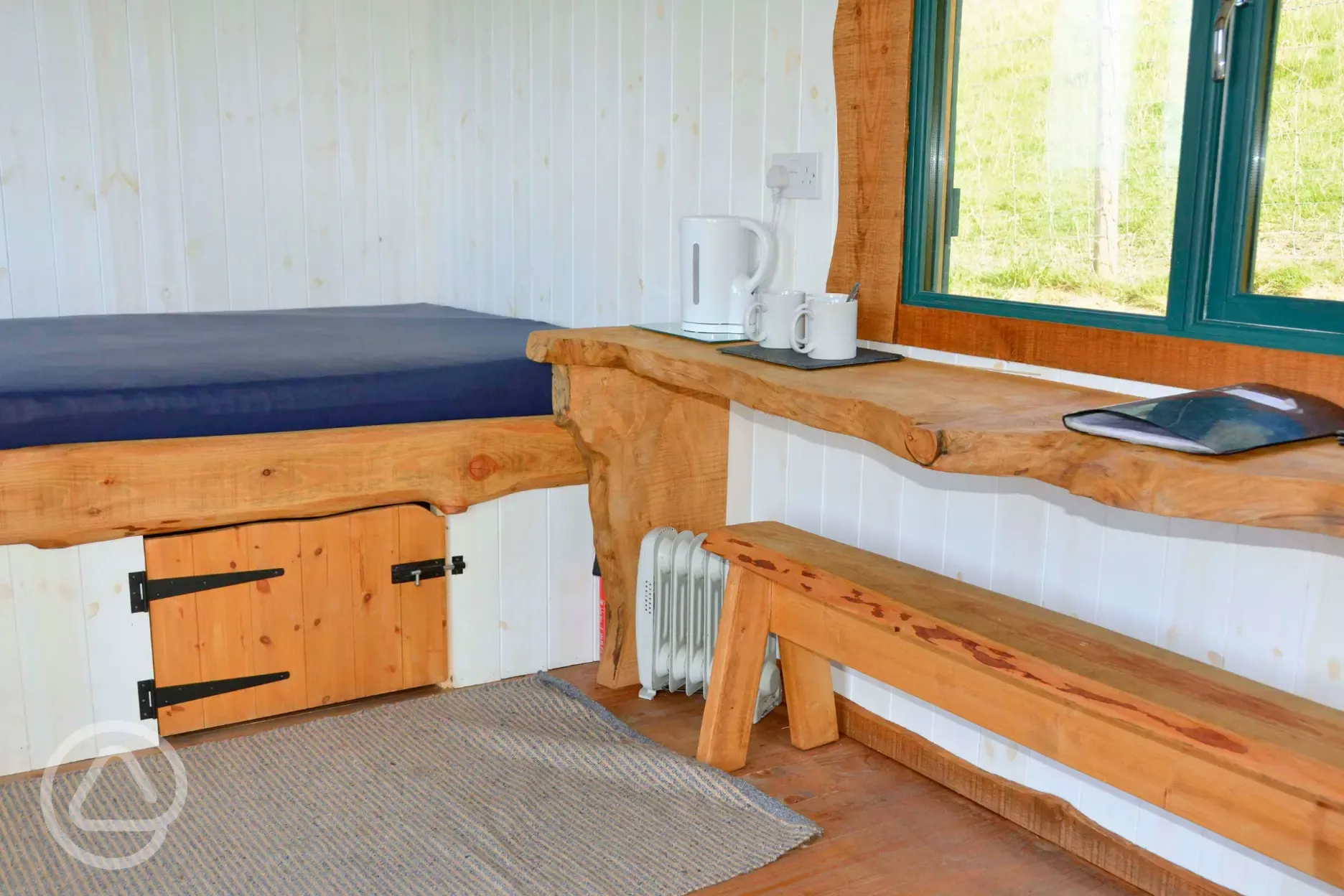 Shepherd hut with a double mattress (bedding not included but can be hired) Shepherd hut with a double mattress (bedding not included but can be hired)