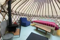 Yurt interior with wood burner