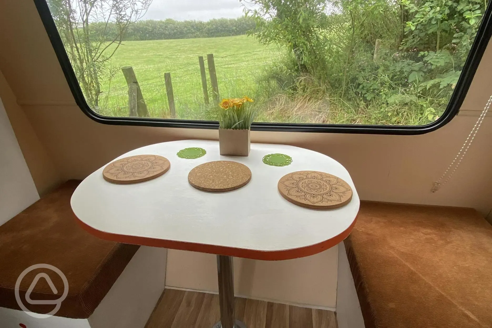 Vintage Bubble caravan seating area with a view over the field