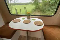 Vintage Bubble caravan seating area with a view over the field