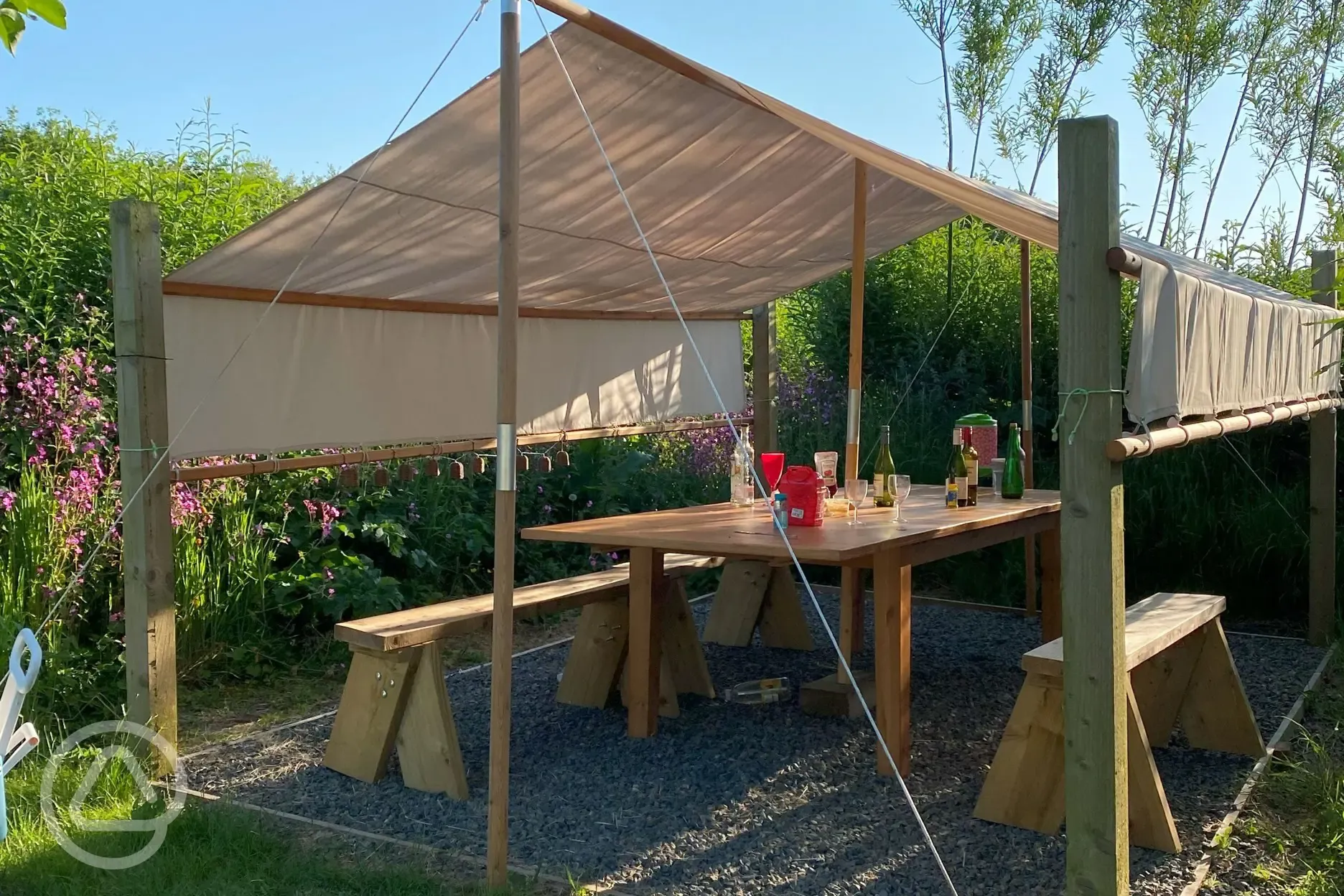 Communal outdoor seating area for the bell tent field