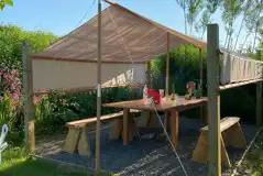 Communal outdoor seating area for the bell tent field