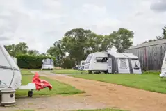 Field barn hardstanding pitches with optional electric at Monks Barn Farm