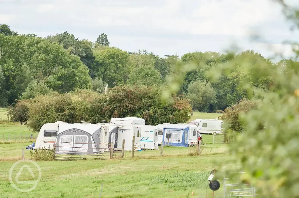 Lower meadow grass pitches with optional electric at Monks Barn Farm Lower meadow grass pitches with optional electric at Monks Barn Farm