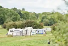 Lower meadow grass pitches with optional electric at Monks Barn Farm