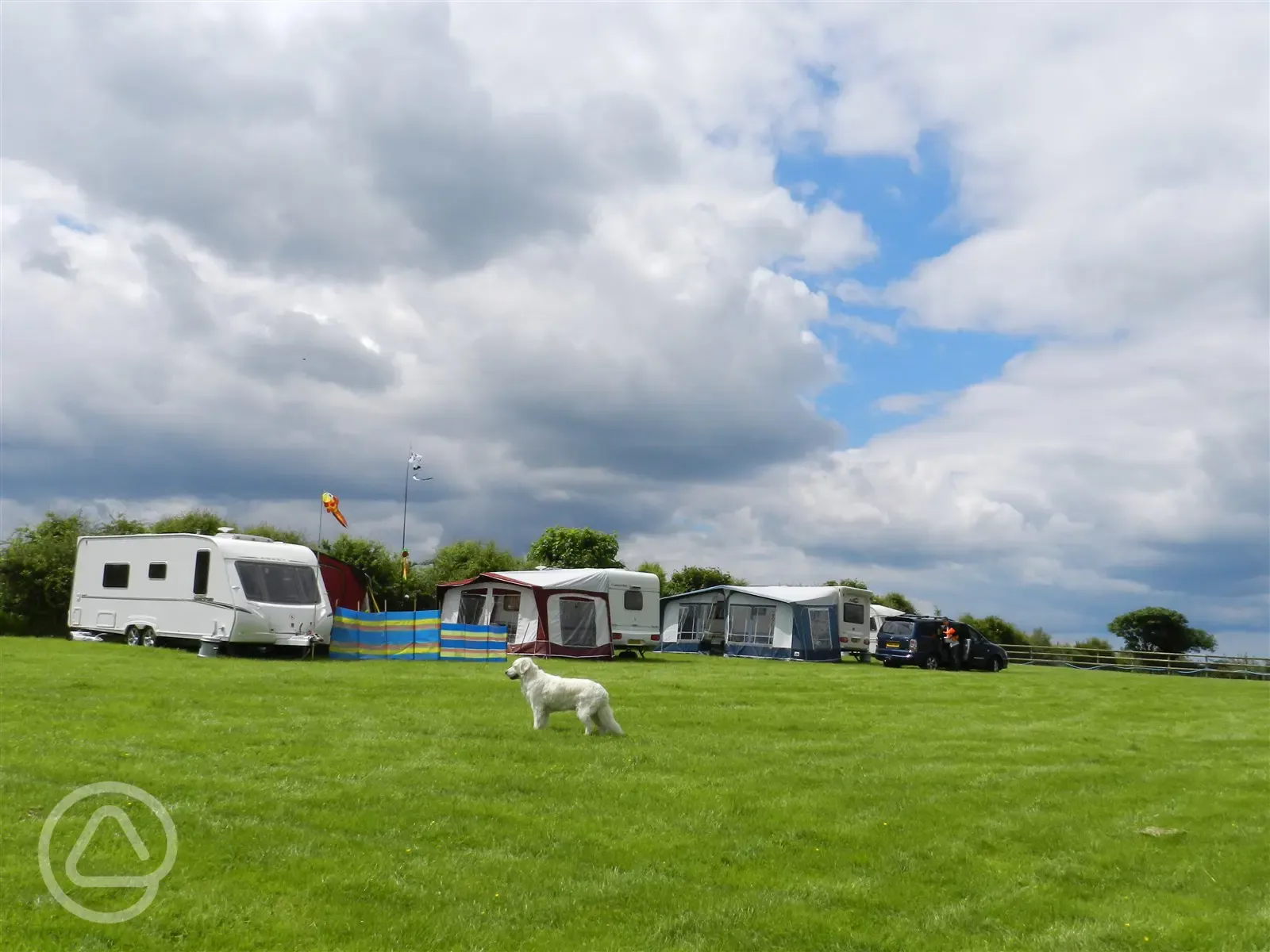 Our lovely flat grassy field with electric hookup