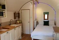 Two person glamping pod with a double bed and ensuite toilet