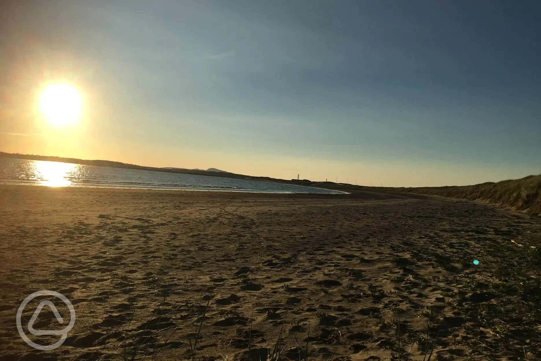 Sunset with sand between your toes on Cymyran Beach