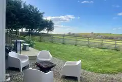 Penkenna shepherd's hut seating area with countryside views