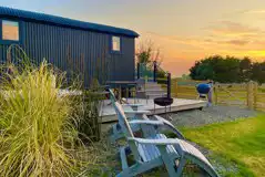 Outdoor seating area at sunset