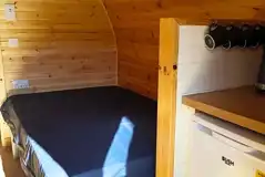 Large hiker pod with sofa bed interior with fridge, mugs, kettle and microwave