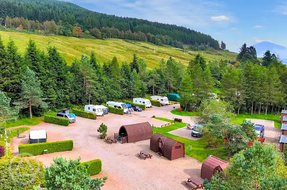 Hardstanding pitches and pods surrounded by trees