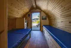 Small ensuite hiker pod interior with TV and mountain views