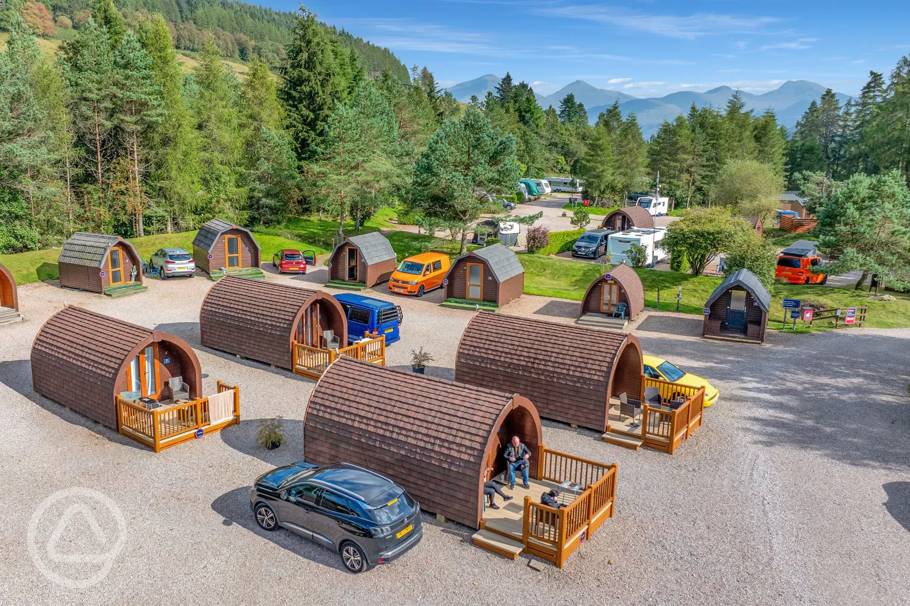 Aerial of the camping and glamping pods with mountain views