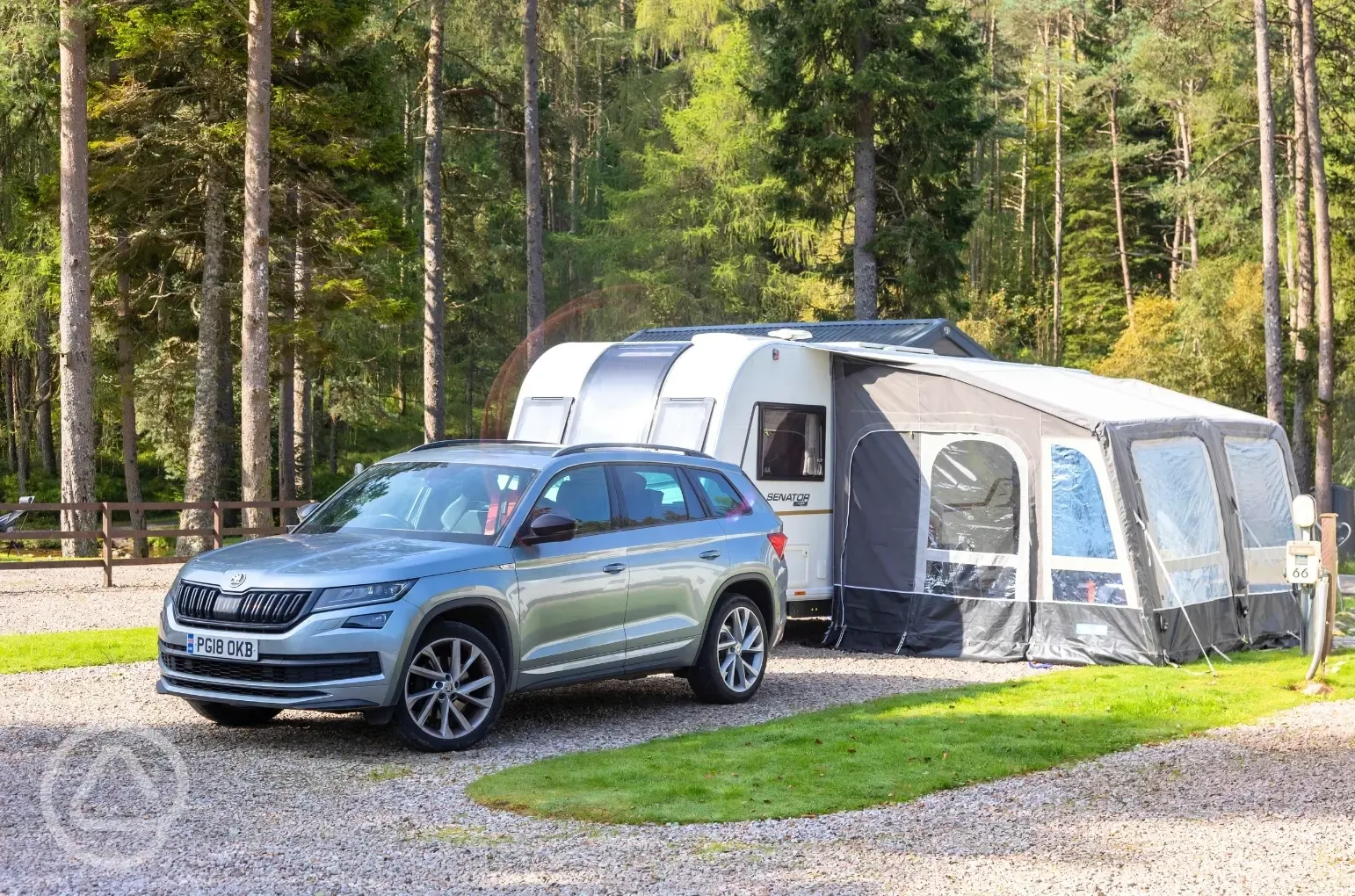 Fully serviced hardstanding touring pitches with a caravan and awning