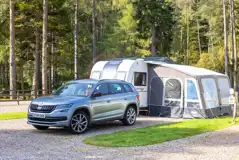 Fully serviced hardstanding touring pitches with a caravan and awning
