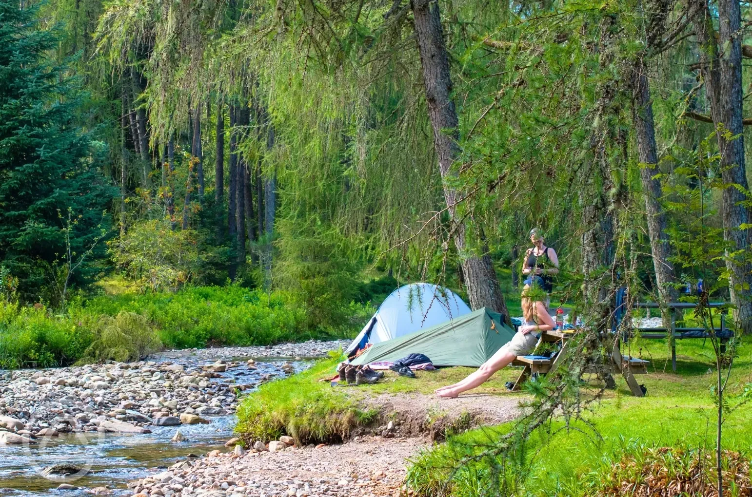 Non electric grass tent pitches by the river