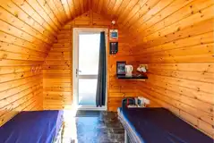 Small hiker pod interior with kettle and mugs