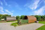 Camping pod with outdoor decking and picnic bench