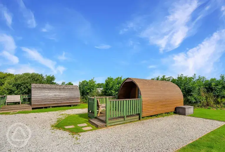 Camping pod with outdoor decking and picnic bench