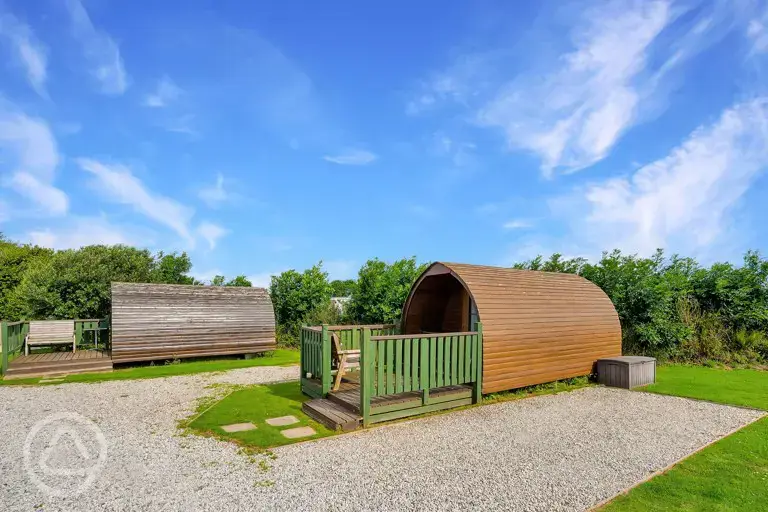Camping pod with outdoor decking and picnic bench