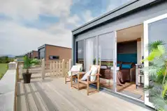 Glamping cabin with outdoor furniture