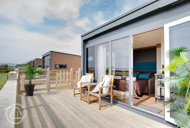 Glamping cabin with outdoor furniture