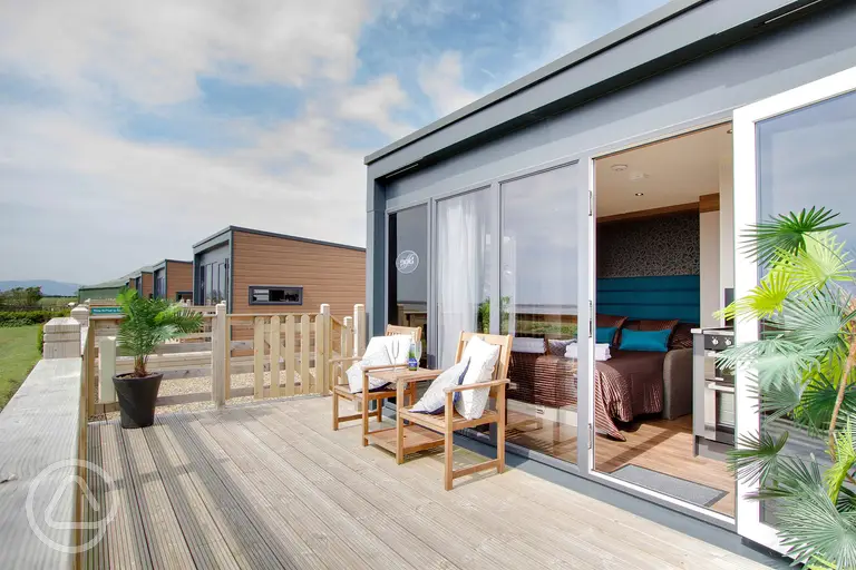 Glamping cabin with outdoor furniture