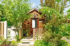 Rosebud cabin with a small deck area and planting Rosebud cabin with a small deck area and planting