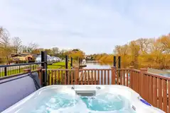 The Ark houseboat with an electric hot tub on the deck