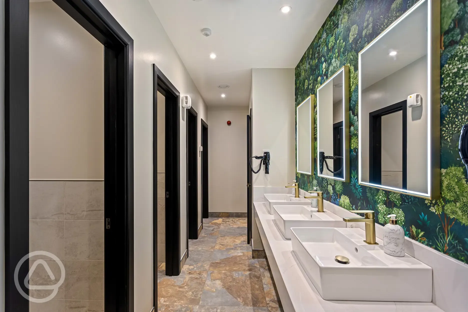 Shared facilities with cubicles, mirrors and sinks