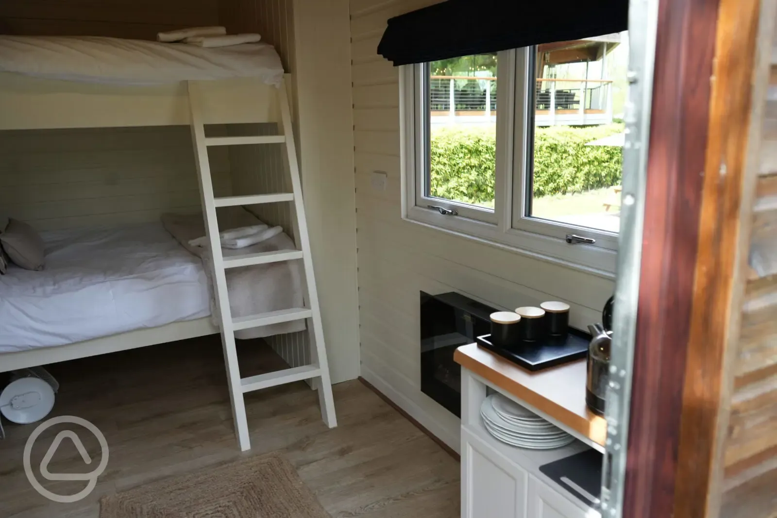 Rosebud glamping cabin interior with double bunk bed