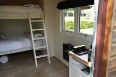 Rosebud glamping cabin interior with double bunk bed