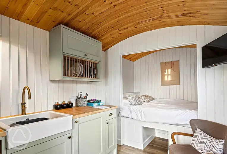 Shepherd's hut with a double bed, kitchenette and TV