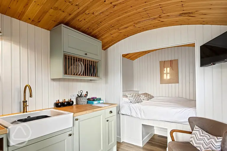 Shepherd's hut with a double bed, kitchenette and TV