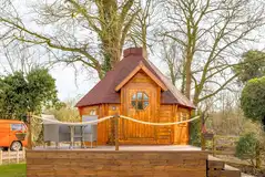 Chestnut glamping cabin with a small deck area Chestnut glamping cabin with a small deck area