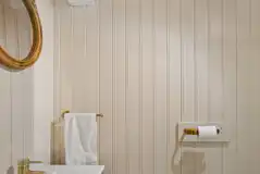 Shepherd's hut facilities with toilet, sink and mirror