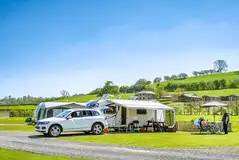 Fully serviced hardstanding touring pitches with electric, water and grey waste