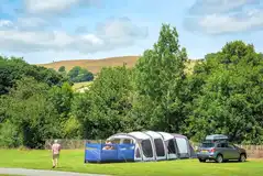 Electric grass tent pitches (4m x 5m) with 16 amp hook ups