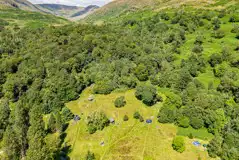 Birdseye view of non electric grass pitches and the distant Lake District