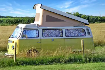 Grass pitches with small campervans welcome