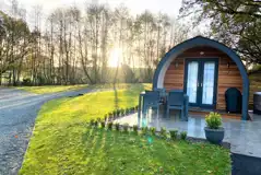 View of luxury Cedar Pod featuring a private hot tub and patio